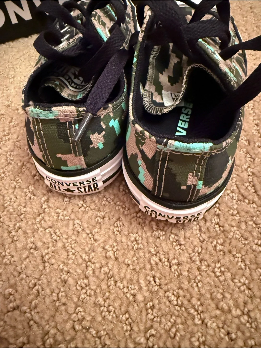 New in box. Converse low sneakers. Size 12